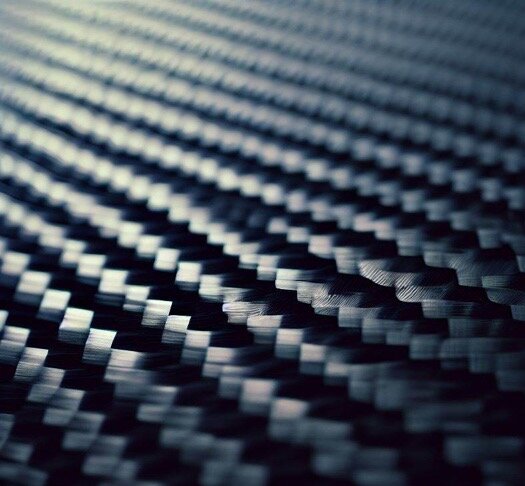 Highly detailed close-up of a carbon surface as material for laser marking.